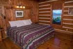 Master bedroom with king size bed and mountain view 